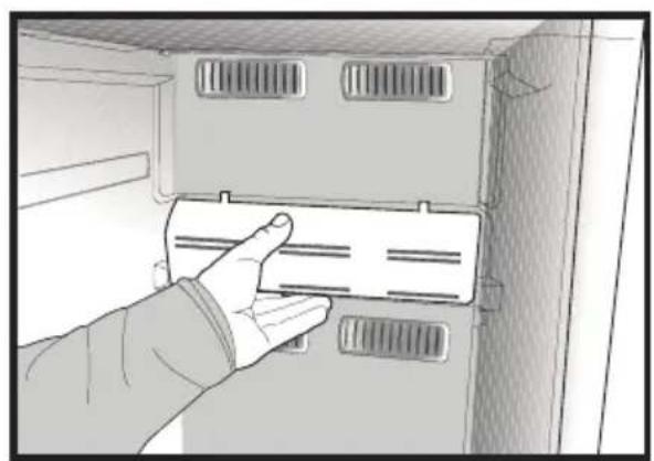 Hand inserting a card into a cabinet or rack unit (no text or symbols visible)