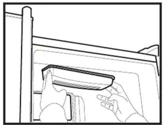 Line drawing of hands installing or adjusting a component inside a vehicle (no text or symbols)