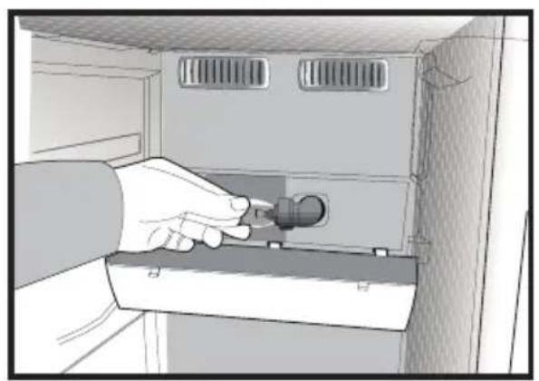 Illustration of a hand inserting a plug into a cabinet (no text or symbols visible)
