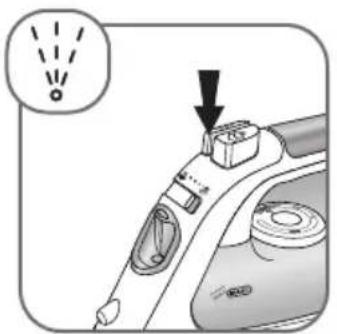 Diagram showing a hand holding a small object with an arrow pointing to it, accompanied by a warning symbol and a magnified view of the object.