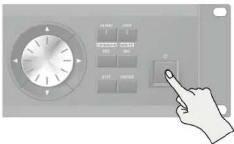 Diagram of an industrial control panel with labeled buttons and a hand pointing to the button, showing text in Chinese.