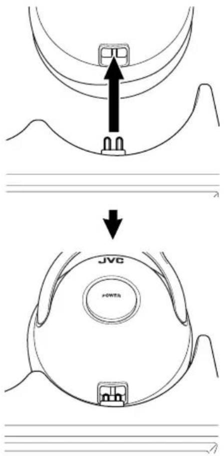JVC HAW600RFG - Setzen Sie den Kopfhörer so auf die Basisstation, dass alle Ladeklemmen festen Kontakt haben. - 1