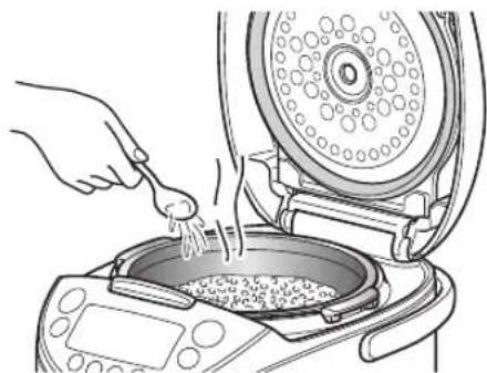 Tiger JKTS10U - Add 1 to 2 tablespoons of water evenly over the rice. - 1
