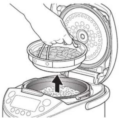 Tiger JKTS10U - Remove the cooking plate and stir and loosen the rice. - 1
