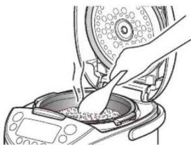 Tiger JKTS10U - Stir the heated oatmeal well and even it out in the inner pot. - 1