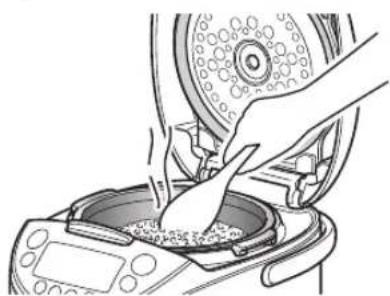 Tiger JKTS10U - Stir and loosen the reheated rice well, and even it out in the inner pot. - 1