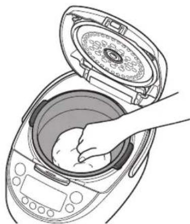 Tiger JKTS10U - Slightly press on the dough to release any trapped gas. - 1