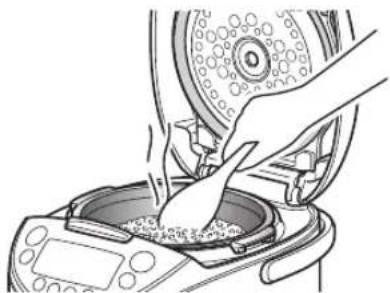 Tiger JKTB18U - Stir the heated oatmeal well and even it out in the inner pot. - 1