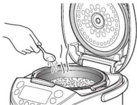 Tiger JKTB18U - Add 1 to 2 tablespoons of water evenly over the rice. - 1