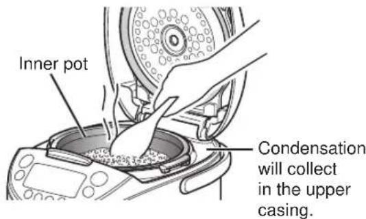 Tiger JKTB18U - Stir and loosen the cooked rice. - 1