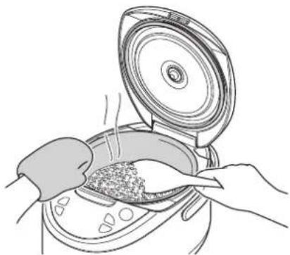 Tiger JAXT10U - Stir and loosen the reheated rice well, and even it out in the inner pot. - 1