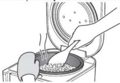 Tiger JAJA55U - Stir and loosen the reheated rice well, and even it out in the inner pot. - 1