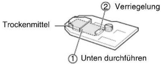 JVC WRMG200 - ② Führen Sie das Trockenmittel an der Rückseite der Bodenplatte ein. - 1