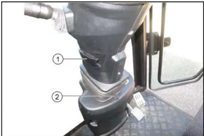 Labeled diagram of a mechanical device showing parts numbered 1 and 2, likely for assembly or maintenance instructions.