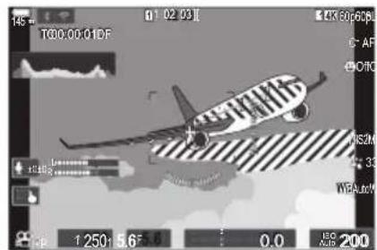 OM SYSTEM OM1 Mark II - Affichage de motifs zèbre sur les zones à forté luminositépendant l'enregistrement video (Réglages motif zèbre) - 2