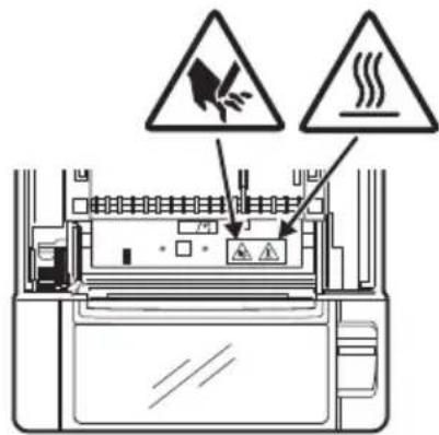 Diagram showing electrical hazard warning symbols above a device with warning signs and warning labels