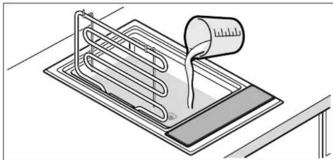 BOSCH PKU375FB1E - Remplir les bacs d'eau et de pierres de lave - 1