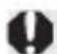 CANON EOS Rebel T7i - While pressing the lens release button, turn the lens as shown by the arrow. - 1