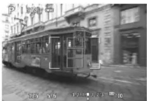 CANON EOS Rebel SL2 - Black-and-white photo of a vintage tram on a city street with buildings and a building in the background (no visible text or symbols) - 1