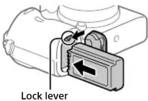SONY Alpha A7R III - Insert the battery pack while pressing the lock lever with the tip of the battery until the battery locks into place. - 1