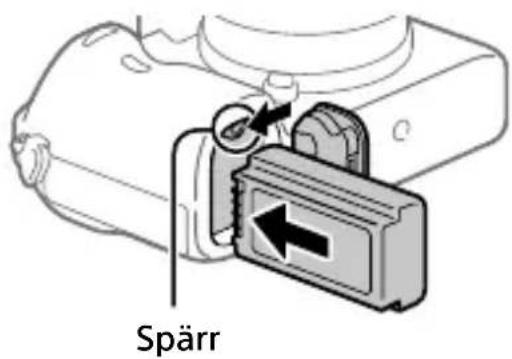 SONY Alpha A7R III - Håll spärren undantryckt med kanten på batteripaketet och skjut in batteripaketet tills det läses på plats. - 1