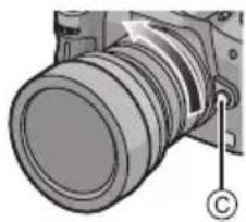 PANASONIC Lumix G 714mm f4 - Press the lens release button © while turning the lens as far as possible in the direction of the arrow to detach it. - 1