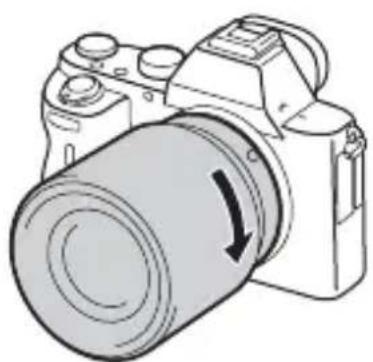 SONY Alpha ILCE7M2K - While pushing the lens lightly toward the camera, turn the lens clockwise until it clicks into the locked position. - 1