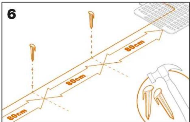 WORX Landroid L WR153E - Fixez le fil au sol à l'aide des chevilles - 1