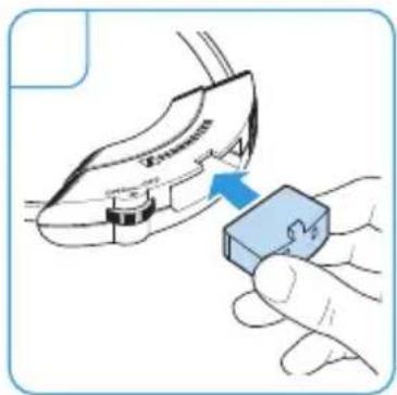 Diagram showing a hand holding a small electronic component with a blue arrow indicating the process.