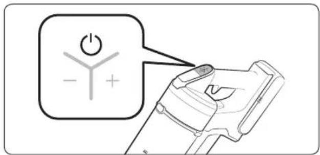 Diagram showing a device with a power symbol and polarity labels, likely illustrating a basic electrical or mechanical concept.