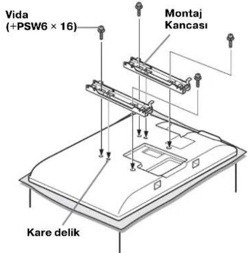 SONY SUWL500 - Sayfa 13'teki Vida ve Kanca konumlari semasi/tablosuna bakarak,vida yerlerini belirleyin ve Montaj Kancasini televizyonun arkasina sabitleyin. - 1