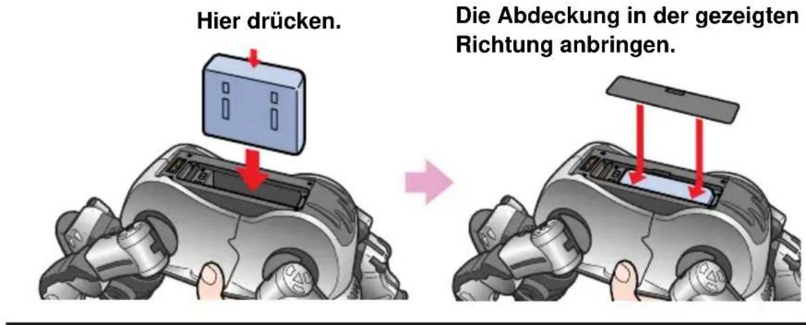 SONY ERS220 - Legen Sie den mitgelieferten Akku in Pfeilrichtung bis zum Einrasten ein und schlieben Sie wieder die Abdeckung. - 1