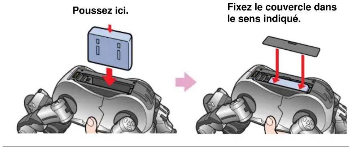 SONY ERS220 - Insérez la batterie fournie dans le sens de la flèche jusqu'au déclic de mise en place, puis remettez le couvercle en place. - 1