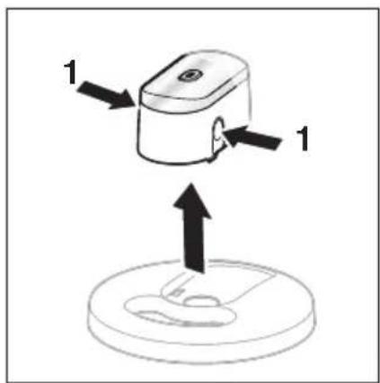 Diagram showing a device with two labeled parts and an upward arrow indicating motion or force, above a circular base.