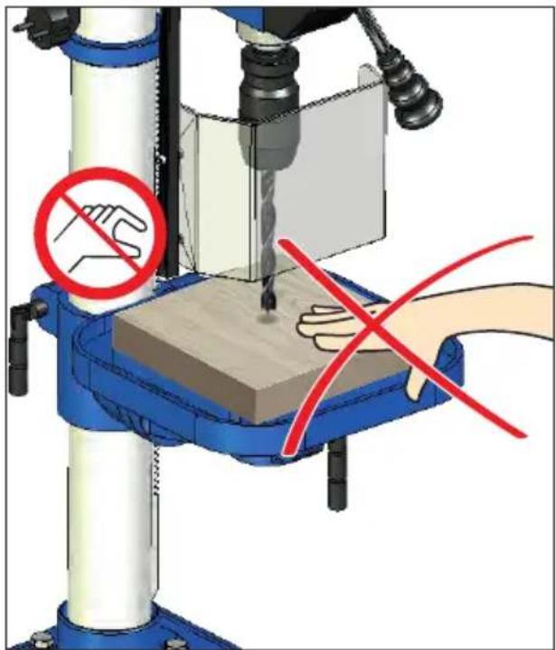 Diagram illustrating a hand operating a drill press with no-handled hand and red prohibition signs