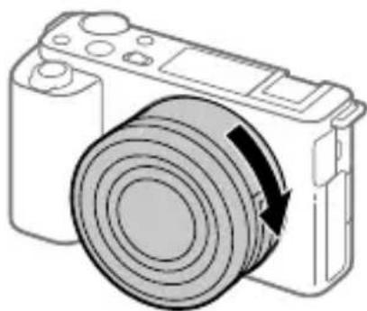 SONY ZVE10L - Sette inn batteriet (inkludert) / minnekortet (selges separat) i kameraet - 1