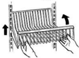 Diagram showing hand positioning of a coiled spring with directional arrows indicating movement or force