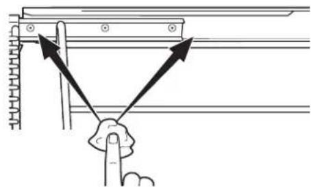 Diagram showing a hand holding a finger with arrows indicating force or direction of movement, possibly illustrating a mechanical or electrical system.