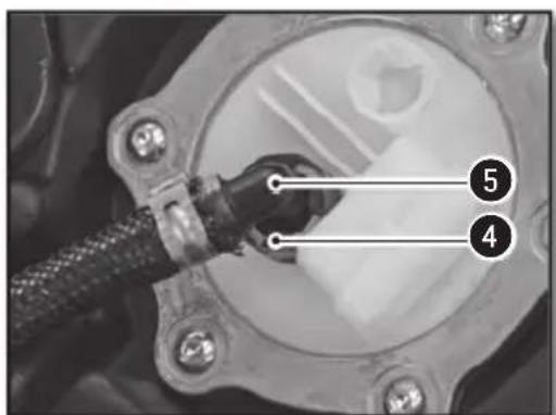 Close-up of a mechanical component with numbered annotations pointing to parts 4 and 5