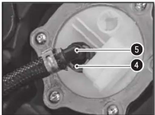 Close-up of a mechanical component with numbered annotations pointing to features