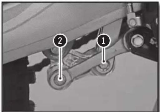 Technical diagram showing two labeled components (1 and 2) of a mechanical assembly with pulleys and gears.