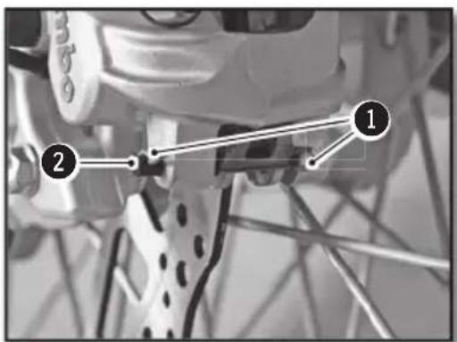 Diagram of bicycle wheel components with numbered labels pointing to specific parts