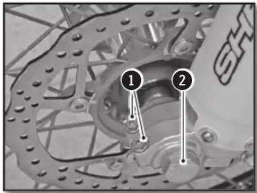 Mechanical diagram showing two labeled components (① and ②) with arrows pointing to mechanical parts.