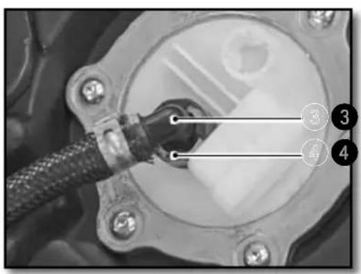 Close-up mechanical component with numbered callouts highlighting parts of a connector or assembly