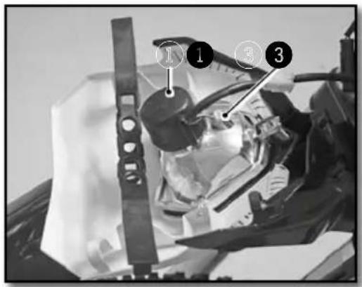 Black-and-white photo of a mechanical device with numbered annotations pointing to parts of the component.