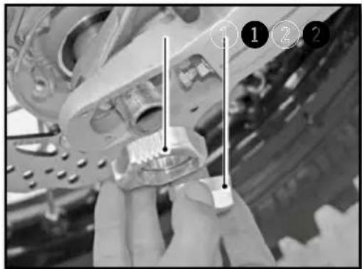 Close-up of hands holding a mechanical component with numbered callouts highlighting parts 1, 2, and 3.