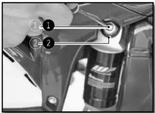 Diagram showing a hand holding a mechanical component with numbered parts labeled 1, 2, and 3.