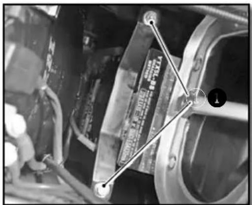 Close-up mechanical assembly photo with visible component labels and numbered annotation