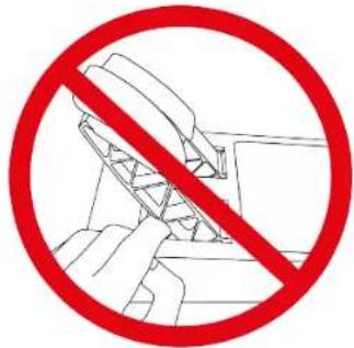 Prohibition sign with red circle and diagonal line crossing over a diagram of hands holding a device, indicating no use or prohibition.
