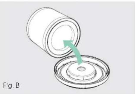 Diagram showing a cylindrical container being inserted into a circular base with a green arrow indicating the process (no text or symbols)